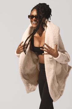 Strut to your morning workout class or down the aisles of Trader Joe’s with our most stylish, oversized Cocoon Coat. This romantic, just-above-the-knee length faux sherpa coat is bound to keep you warm and snug, all cozy-weather season. Our favorite feature: the thumb holes on the sleeves for warmth from head to fingertip. Comfy Oversized Outerwear With Soft Texture, Oversized Outerwear With Soft Texture For Loungewear, Oversized Cozy Fur Coat For Cold Weather, Soft Textured Winter Outerwear For Loungewear, Soft Texture Outerwear For Loungewear, Comfortable Soft Outerwear For Loungewear, Comfy Oversized Winter Outerwear, Oversized Soft Outerwear For Cold Weather, Cozy Fleece-lined Outerwear For Loungewear