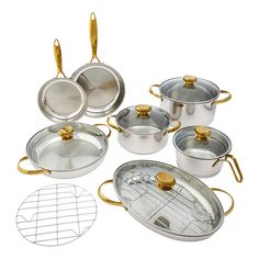 an assortment of pots and pans with gold handles