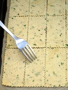 a fork resting on top of some crackers