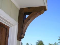 an open door with a wooden arch on the outside