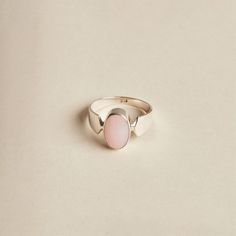 The Pink Opal is a lovely stone to wear. Its soft, baby pink oval cabochon is highlighted by the band's design. The ring is made with 925 sterling silver. The ring is available in size 7 1/4. Dimensions: Total height: 13mm Total width: 8mm Stone height: 12mm Stone width: 8mm Stone + bezel thickness: 6mm Band width: 7mm to 3mm - Please note - * Additional photos and videos available on request * Go to 'About us' section for links to our socials and website * Only the ring from first picture is in Oval Cabochon Opal Ring With Polished Finish, Elegant Pink Opal Sterling Silver Ring, Pink Ring With Polished Finish, Elegant Pink Opal Ring In Sterling Silver, Sterling Silver Ring With Large Pink Stone, Classic Pink Oval Cabochon Ring, Elegant Pink Opal Oval Jewelry, Pink Opal Rings As A Gift, Pink Oval Opal Ring In Sterling Silver