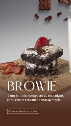 chocolate brownies and strawberries on a cutting board next to a glass of milk