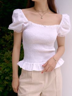 Short sleeve 100% cotton blouse with shirring, balloon sleeves with elastic cuff and ruffle hemline. Square neckline. Model is in MINUSEY ONE SIZE. * MINUSEY ONE SIZE = EU 34-38, US 2-6* 100% Cotton* Dry clean* Made in Korea - Model Height: 170cm/5'7" (US2, EU34) Casual Tops With Ruffle Hem And Puff Sleeve, Summer Tops With Ruffle Hem And Puff Sleeves, Summer Puff Sleeve Top With Ruffle Hem, Summer Tops With Smocked Cuffs And Billowy Fit, Billowy Summer Tops With Smocked Cuffs, Summer Blouse With Smocked Ruffle Sleeves, Cotton Smocked Back Puff Sleeve Top, Cotton Smocked Top With Smocked Cuffs, Cotton Puff Sleeve Top With Smocked Back