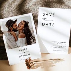 two wedding save the dates cards sitting next to each other