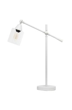 a white desk lamp sitting on top of a table