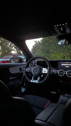 the interior of a car with dashboard lights and steering wheel, dash camera on display