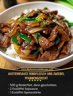 a white bowl filled with beef and onions over rice on top of a wooden table