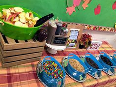 an assortment of fruits and cereals are on display at a school luncheon table