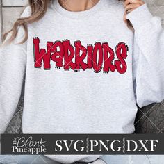 a woman wearing a sweatshirt with the word warriors printed on it in red and black