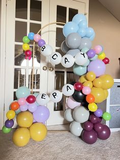 balloons and letters are arranged in the shape of an e, b, c, d