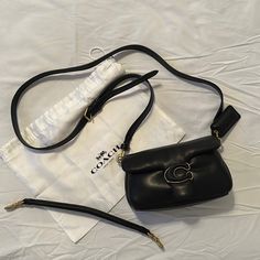 Nappa Leather Inside Multifunction Pocket Snap Closure, Fabric Lining Detachable Handle With 4" Drop Detachable Long Strap With 21 1/2" Drop For Shoulder Or Crossbody Wear 7 1/4" (L) X 4" (H) X 2 1/2" (W) Style No. C3880 The Pillow Tabby Reimagines The Structured Silhouette Of An Archival 1970s Coach Design With Plush, Ultra-Soft Leather And Wrapped Signature Hardware. Smaller Than Our Beloved Tabby Shoulder Bag 26, The Petite 18 Features Two Detachable Straps To Carry By Hand, Style As A Should Coach Shoulder Bag With Adjustable Strap, Coach Pillow Tabby Black, Coach Tabby Pillow Bag, Black Coach Shoulder Bag With Detachable Handle, Coach Pillows, Coach Black Shoulder Bag For On-the-go, Signature Hardware, Nappa Leather, Coach Bags