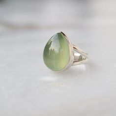 Natural Prehnite sterling silver ring, Gemstone Jewelry, Prehnite jewelry, Christmas Gift, silver jewelry, July Birthstone ring, Minimalist Be assured that the product you order is CUSTOM MADE JUST FOR YOU and is not a mass produced item. The gemstone is a Pear Shaped Prehnite of 13 x 18mm. The Ring is made from 925 STERLING SILVER i.e. 92.5% pure silver. And it DOESN'T HAVE ANY LEAD OR NICKEL. Please note that silver will tarnish with time , it is a natural property of silver to tarnish so to p Green Cabochon Moonstone Ring In Sterling Silver, Green Sterling Silver Moonstone Ring Gift, Green Opal Ring In Sterling Silver For Gift, Gift Green Opal Ring In Sterling Silver, Green Opal Ring In Sterling Silver As Gift, Prehnite Jewelry, July Birthstone Ring, Artisan Rings, Jewelry Christmas