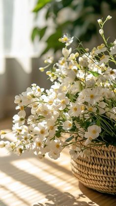 white flowers in a basket on a table