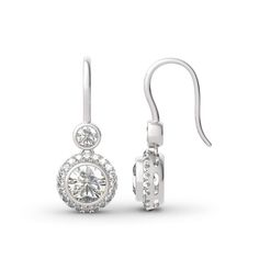 This beautiful style is a perfect gift for any lady or the perfect reason to spoil yourself! Designed in sterling silver, each earring features a sparkling round cut stone wrapped in a glistening halo as the drop. All stones glisten with every beat of her heart and every turn of her head. Celebrate your sweetheart with these sweet drop earrings.Carat Weight: 5 ctStone Size: 7 mmStone Type: Jeulia® StoneNumber of Stones: 2 Carat Weight: 1.29 ctStone Size: 1.3,4 mmStone Type: Jeulia® StoneNumber o Fashion Edgy, Stone Wrapping, Earrings Drop, Everyday Earrings, Silver Drop Earrings, Online Earrings