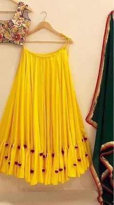 Stunning Yellow Georgette Sleeve Less Choli Lehenga for Haldi Function Festive Sharara With Tassels For Reception, Traditional Fitted Sets With Tassels, Traditional Fitted Set With Tassels, Diwali Sets With Tassels, Wedding Sets With Tassels For Diwali, Festive Wedding Dresses With Tassels, Festive Tasseled Wedding Dresses, Festive Floor-length Sets With Tassels, Festive Wedding Sets With Tassels