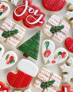 decorated christmas cookies with the word joy on them