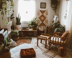 a living room filled with lots of plants and furniture