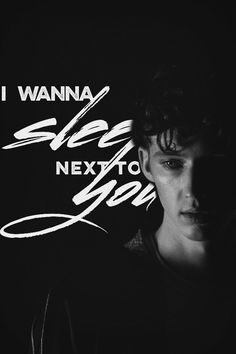 i wanna see next to you poster with young man in black and white photo against dark background