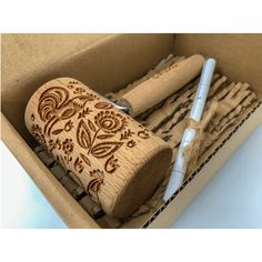 a box filled with wooden stamps and pens