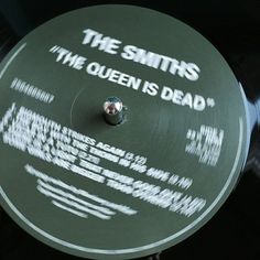 an old record with the words the smiths and the queen is dead on it