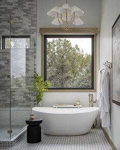 a white bath tub sitting next to a window