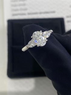 an engagement ring with three stones on it