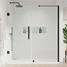 a bathroom with white tile and black accents