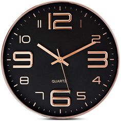 a black and rose gold clock with numbers on the face is shown against a white background