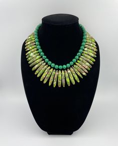 "PLEASE NOTE: The color may be slightly different from the pictures on different devices. This beautiful Green Yellow Jasper and Malachite Statement Necklace is completely handmade with high quality. Matching earrings are available. This gorgeous Jasper Statement Necklace goes with everything and everywhere, holiday party or after work with friends. Necklace made from green malachite round beads 10 mm, and green yellow graduated jasper 18~46 x 4~8 x 6~9 mm. The Necklace length is 16.5\" short la Green Malachite Gemstone Bead Necklaces, Handmade Green Malachite Necklaces, Green Beaded Necklace With Natural Stones, Green Malachite Gemstone Beads Necklace, Green Malachite Handmade Necklace, Handmade Green Malachite Necklace, Green Faceted Artisan Beads, Green Artisan Faceted Beads, Artisan Green Faceted Beads