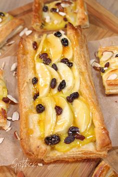 there are bananas and raisins on top of this pastry, which is cut in half