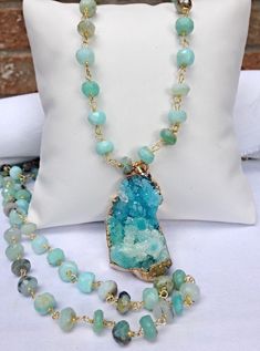 "Peruvian Blue Opal is a beautiful gemstone with shades ranging from a light minty turquoise to more of a sky blue and then off to a green/ turquoise blend. Every once in a while a somewhat grayish black will occur.  Each hand faceted rondelle stone is hand wired to the next using vermeil wire. All the metal findings are gold filled and I use a lobster claw clasp for the best security.  When ordering, keep in mind that a 36\" length gives you the most versatility. You can layer shorter pieces with it and double it up for major impact at your neckline. The Druzy in the main photograph has sold.  The fourth photograph gives you an idea of my Aqua Druzy collection. To see my other gemstone chains and more of my collection, please visit my shop at: ❤️ Cut Chain Is Not Returnable❤️ www.ShalomJe Turquoise Aquamarine Gemstone Necklace, Turquoise Aquamarine Beaded Necklace, Turquoise Aquamarine Gemstone Beads Necklace, Turquoise Aquamarine Necklace With Natural Stones, Turquoise Aquamarine Natural Stones Necklace, Turquoise Aquamarine Spiritual Necklace, Aquamarine Gemstone Beads Jewelry As Gift, Aquamarine Gemstone Bead Jewelry As Gift, Gift Turquoise Aquamarine Necklace