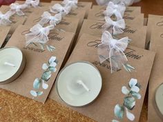 place cards with flowers and ribbons on them are laid out for guests to enjoy the day