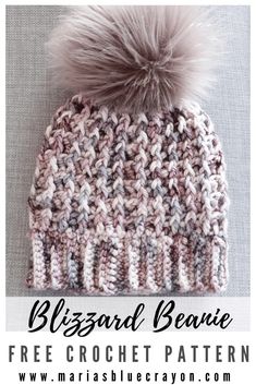 a crocheted beanie with a pom - pom on top and text that