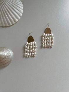 Shell Wind Chimes Earrings | Jewelry | Three Fleas Bohemian White Pearl Earrings, Unique Handmade Pearl Jewelry, Handmade Unique Pearl Jewelry, Handmade Pearl White Pearl Earrings, Handmade White Earrings In Mother Of Pearl, Bohemian White Dangle Pearl Earrings, White Bohemian Dangle Pearl Earrings, Bohemian White Pearl Beaded Earrings, Handmade Pearl White Dangle Pearl Earrings