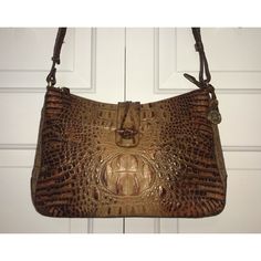 Beautiful Vintage Brahmin Shoulder Bag In Toasted Almond. Purse Is In Excellent Condition And Shows No Wear As It Was Only Carried Once Or Twice. The Strap Can Be Adjusted From Approximately 23” To 43”. Strap Is Long Enough To Be Carried As A Crossbody. Bag Has A Key Ring Clip, Two Loops To Hold Pens Or Pencils, Two Inner Pockets On Front, One Inner Pocket That Zips On Back, And One Exterior Pocket On Front Of Bag. Ring Clip, Brahmin Bags, Key Ring, Crossbody Bag, Almond, Bag Lady, Purse, Key, Exterior