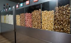 an assortment of different types of popcorn on display