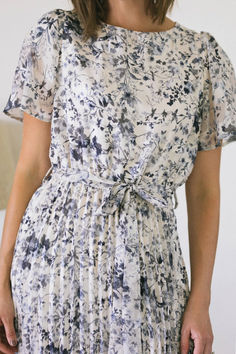 Step into effortless elegance with this cream multi pleated floral dress. The soft cream base is adorned with a vibrant floral print, creating a beautiful contrast that exudes sophistication. Delicate pleats flow gracefully from the waist, adding movement and texture to the A-line silhouette. Featuring a subtle square-neckline and flutter sleeves, this dress is perfect for garden parties or special occasions. #FloralElegance #PleatedPerfection #GardenPartyStyle #SophisticatedChic #FeminineFlair Julia Roberts Pregnant, Floral Dres, Cream Base, Garden Parties, Effortless Elegance, Flutter Sleeves