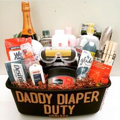 a gift basket filled with alcohol and personal care items, including an adult sized safety goggles