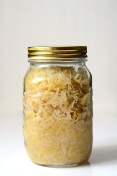 a glass jar filled with food sitting on top of a table