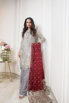 SKU: 1107 Price for Shirt, lining and Dhaka Pyjama A soft pure net with our signature embroidiery of floral net handwork, resham, tilla, crystals, kora, and sequence. Cutwork border used in this outfit gives a modern look to this outfit. Double layered Dhaka Pyjama is gives oomph to this outfit. Dupatta as is can be added. Shirt length 38. Model is wearing XS. Designer Net Sharara For Eid, Festive Sets With Dabka Work On Net, Festive Net Sets With Dabka Work, Eid Traditional Wear With Dabka Work On Net, Festive Designer Net Salwar Kameez, Embroidered Net Dresses For Eid, Designer Net Traditional Wear For Eid, Designer Traditional Net Wear For Eid, Eid Salwar Kameez With Dabka Work On Net