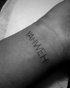 a black and white photo of a person's arm with the word human on it