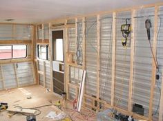 the inside of a house being remodeled with wood framing and electrical wires on the wall