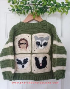 a crocheted sweater with pictures of animals on it