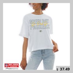 Show out for your Green Bay Packers in this Keep Playing Boxy Fit T-Shirt from Gameday Couture. The team logo and wordmark is backed up by a recognizable Green Bay Packers saying, making this tee great for game days. Its cropped hem provides the perfect fit for a comfortable and stylish wear. Casual Tops With Logo Lettering, Sporty Logo Tops For College, Collegiate Cotton Tops With Logo, Crew Neck Tops With Logo For Sports Season, Graphic Tee With Logo For Fan Merchandise, Fan Merchandise Graphic Tee With Logo, Collegiate Logo Crew Neck Tops, Collegiate Crew Neck Top With Logo, Crew Neck T-shirt With Team Spirit