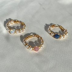 (items are shipped between 1-2 days) *Now available in silver!  A gold braided wire wrapped rings made with pearls and a round gemstone. Available in sodalite, opalite, and pink cat's eye! 💗I love pairing these dainty gemstone rings together but they also look cute on their own. They also make great gifts for loved ones.  All orders come in a white mesh bag making them great to gift in.  💗I recommend avoiding water and keeping it stored away when not being worn to maintain its quality. More Cr Pear Rings, Pearl Ring Gold, Gold Wire Ring, Diy Wire Jewelry Rings, Gold Wrap Ring, Wire Jewelry Rings, Etsy Jewelry Handmade, Diy Beaded Rings, Crystal Bead Jewelry