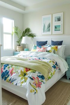 a bedroom with white walls and floral bedding