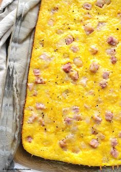 a square casserole dish with meat and cheese