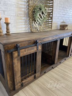 a wooden dog crate with metal bars on top