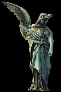 an angel statue holding a flower in its hands