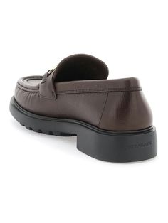 Step up your style game with these sleek and sophisticated loafers. The embossed leather and double-finish Gancini detail add a touch of luxury, while the raised stitched apron and chunky rubber sole provide a comfortable and durable fit. Perfect for those with wider feet, these loafers offer both style and comfort for any occasion. Embossed leather construction Double-finish Gancini detail Raised stitched apron Chunky rubber sole Fit: EEE Ferragamo Men, Prada Designer, Balenciaga Designer, Designer Sunglasses, Leather Loafers, High Quality Leather, Watch Design, Embossed Leather, Step Up